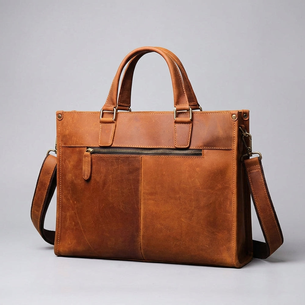 Bruine vintage leren aktetas/werktas, ideaal voor laptops, met handige organisatievakken voor zakelijk gebruik.
