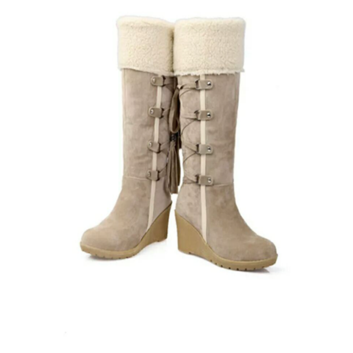 Zwarte warme winterboots voor dames met elegante sleehak. Comfortabele en stijlvolle damesschoenen.
