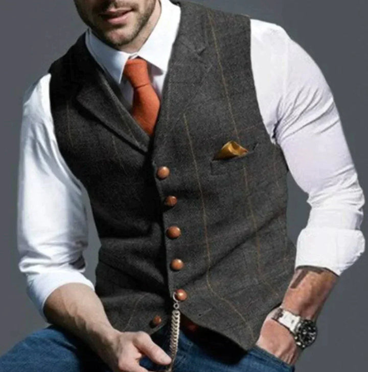"Stylisch herenvest, klassiek patroon, duurzame tweed stof, geschikt voor formele en casual gelegenheden."