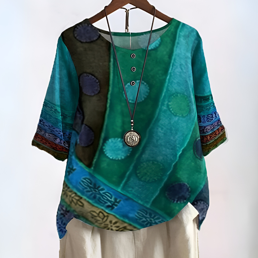 Modieuze printblouse voor dames met trendy patroon en handige driekwart mouwen, ideaal voor modebewuste vrouwen.