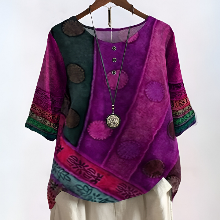 Elegante damesblouse met levendige print en praktische driekwartmouwen, een trendy toevoeging aan je kleding.