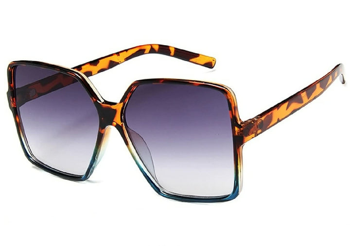 Trendy Grote Dames Zonnebril met Gekleurde Glazen, stijlvolle zomeraccessoire voor vrouwen.