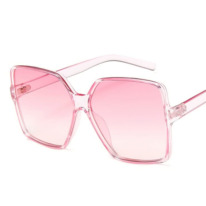 Vrouwenmode: Grote InStyle™ zonnebril met trendy gekleurde glazen, een chic accessoire voor de zomer.