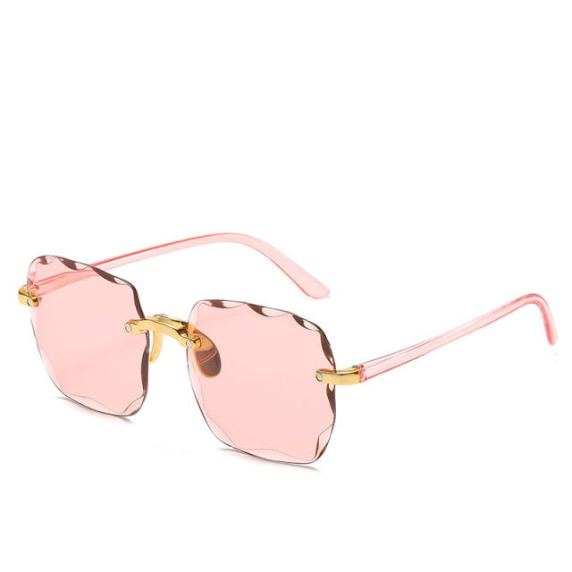 Clea randloze zonnebril: uniseks vintage design met hoge UV400 oogbescherming. Trendy voor elke zomerdag.