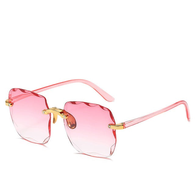 Mode accessoire: trendy uniseks randloze zonnebril Clea. Biedt UV400 bescherming, perfect voor zomerse dagen.
