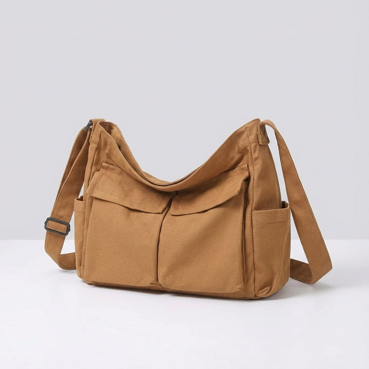 Zwarte duurzame canvas crossbody tas, ideaal voor werk of vrije tijd.