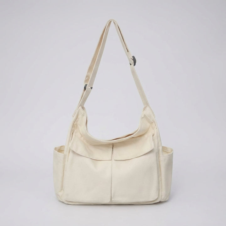 Veelzijdige unisex canvas tas, geschikt voor dagelijks gemak en onderweg.
