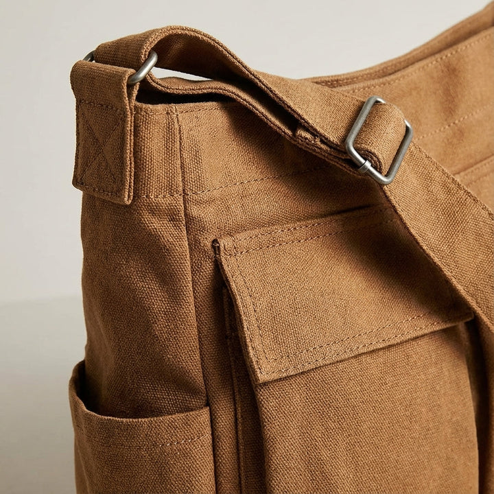 Lichtgewicht unisex schoudertas van canvas met veel vakken, comfortabel voor dagelijks gebruik en eenvoudig mee te nemen.