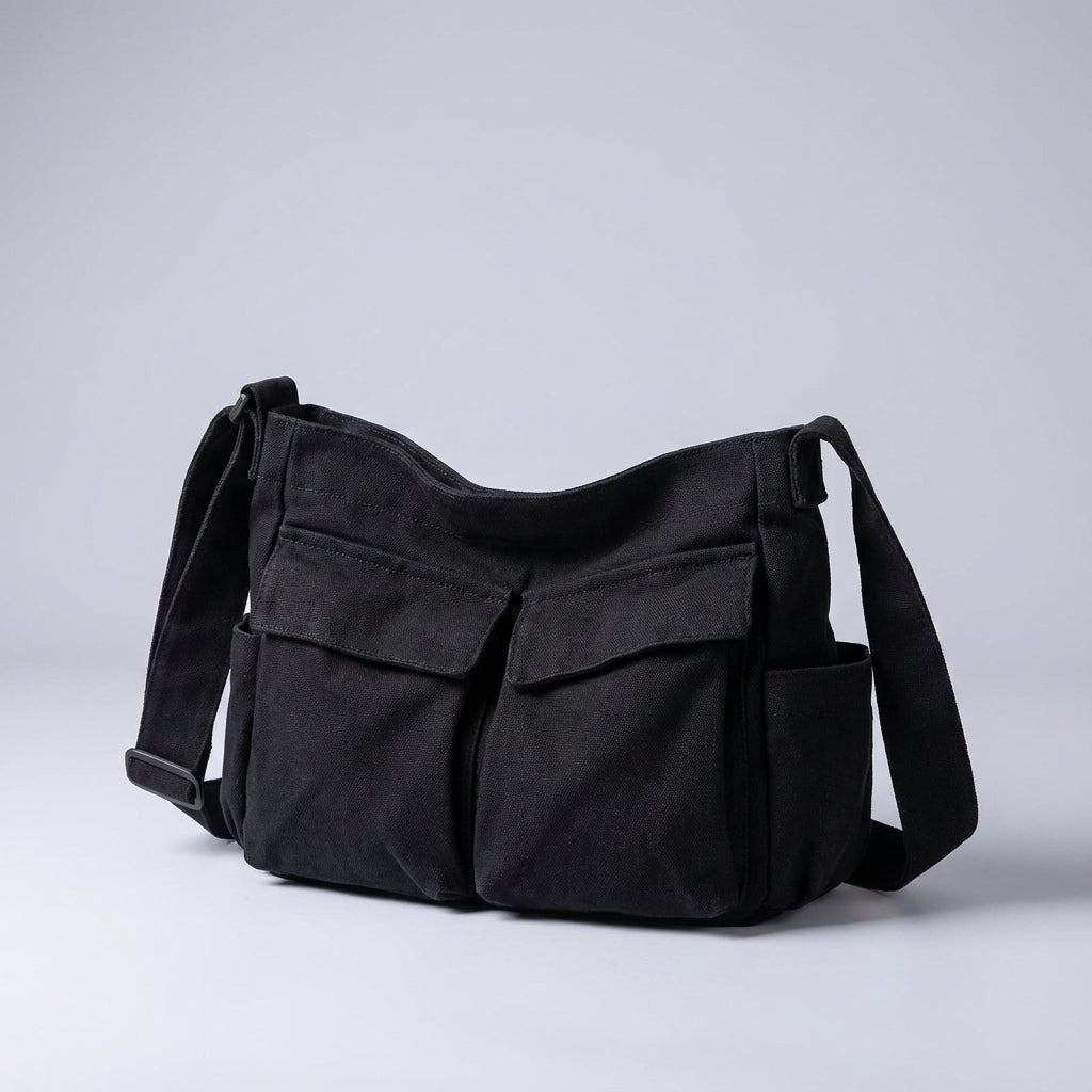 Duurzame canvas schoudertas in unisex design, voorzien van multi-vakken voor optimale organisatie als crossbody tas.