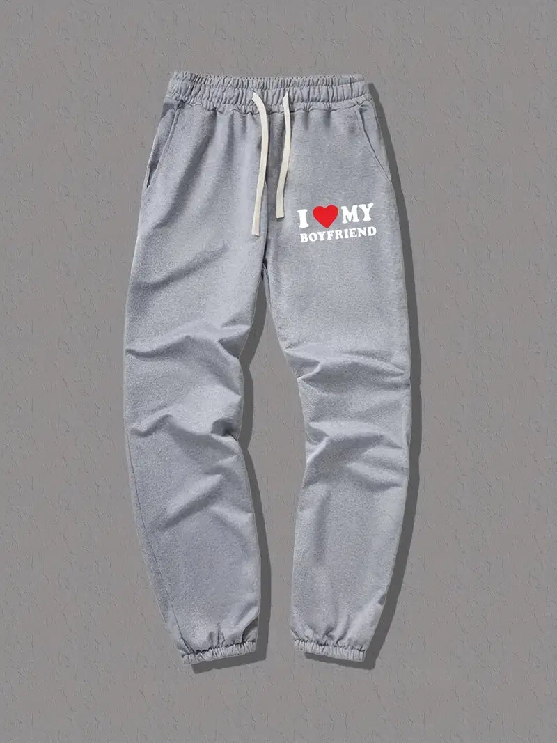 Modieuze unisex liefdes joggingbroek. Toon genegenheid met deze zachte, trendy sweatpants voor vrije tijd.