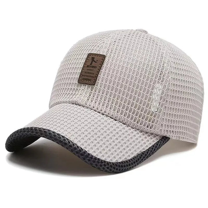 Unisex luchtige zomerpet, ademend en sneldrogend, ideaal voor comfort tijdens warme dagen en sport. Gemaakt van polyester.