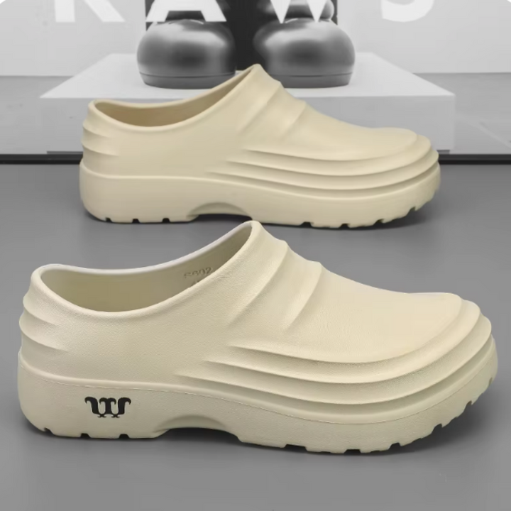 Waterdichte AquaStep klompen, unisex, orthopedisch, ideaal voor hielspoor en ondersteuning.