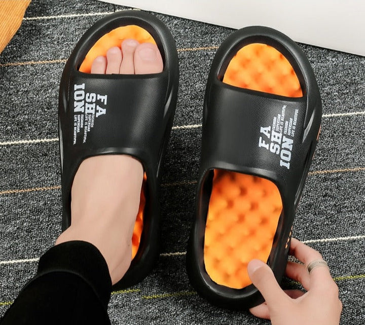 Voorzijde unisex orthopedische massageslippers, ontworpen voor comfort, boogondersteuning en algemene voetontspanning.