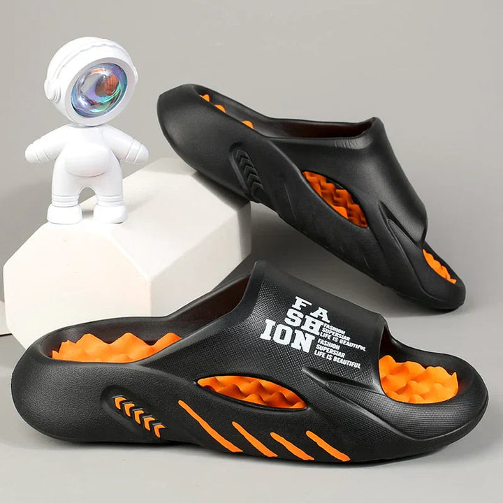 Paar unisex orthopedische massageslippers, ideaal voor dagelijks comfort, boogondersteuning en ontspanning thuis.