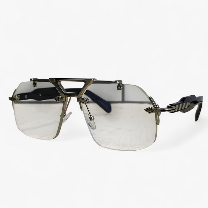 Oversized zonnebril met randloos design en metalen accenten. Ideaal voor een trendy, futuristische look.
