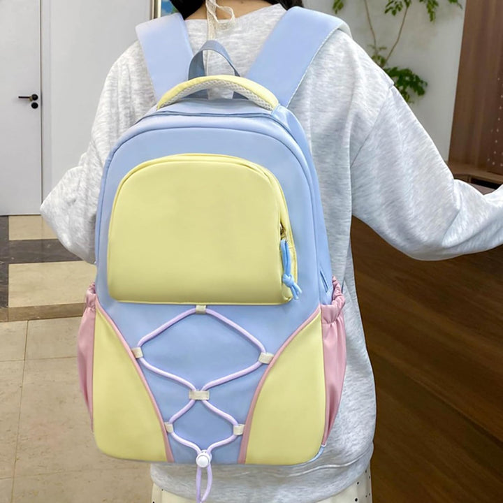 Duurzame Nivora studentenrugzak (paars/blauw) uit de set; grote capaciteit voor boeken en laptop.