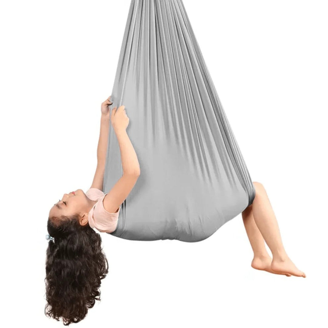 Kinder hangmat & volwassen schommel in één. Een sensorische ervaring voor focus & plezier bij therapie.