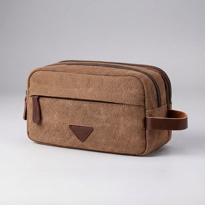Compacte unisex reistoilettas Tripelle. Dubbel compartiment van waterdicht canvas voor georganiseerde reisaccessoires.