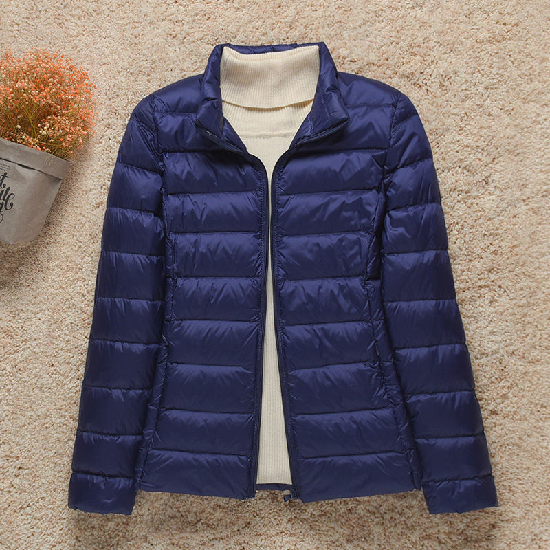 Genderneutrale ultralichte gewatteerde jas met capuchon, warm en comfortabel voor elk seizoen.