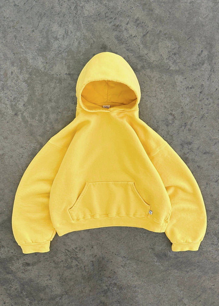 Casual unisex hoodie in zonnig geel, brengt kleur en warmte in je outfit.