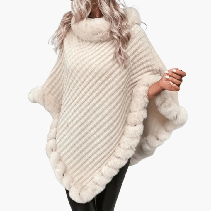 Warme gebreide vrouwenponcho met stijlvolle nepbont rand, perfect voor gelaagdheid in de koude maanden.
