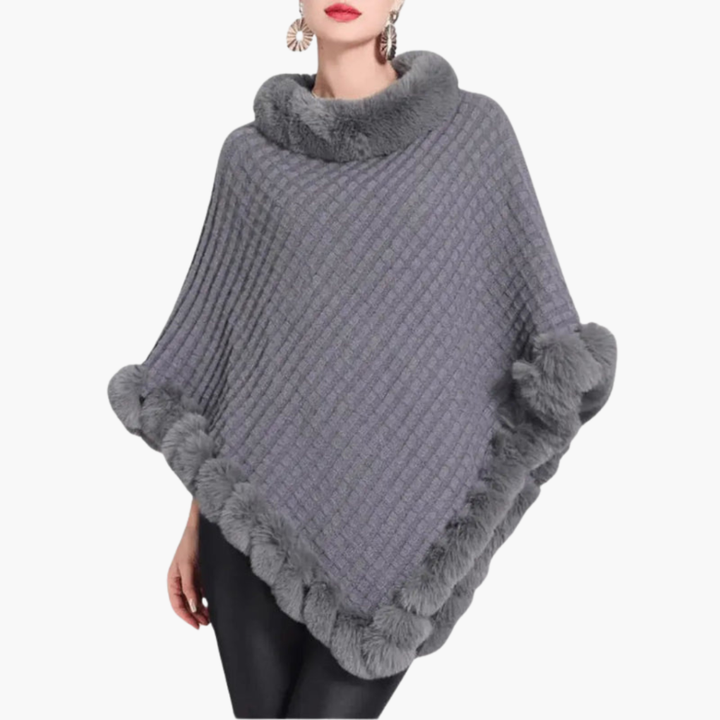Elegante gebreide poncho met nepbont trim voor vrouwen, warm en veelzijdig. Een must-have herfst/winter accessoire.