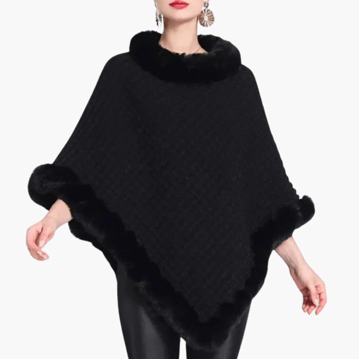 Zachte gebreide oversized poncho voor dames met chique nepbont afwerking. Comfortabele en trendy winterkleding.