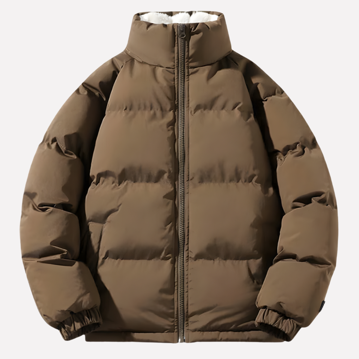 Warm dames pufferjack met zachte fleecevoering, capuchon en doorgestikt design voor wintercomfort.