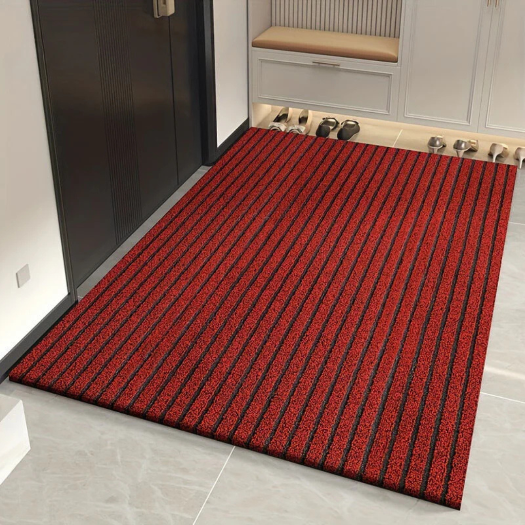 Weerbestendige rode buitenmat van duurzaam PVC met antislip, houdt entree schoon en huis vrij van vuil.