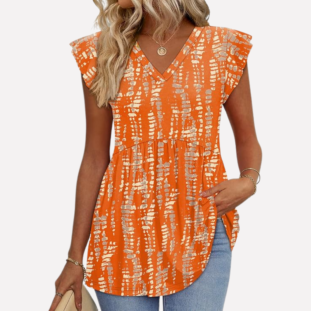 Veelzijdige dames blouse (AM1) in witte katoen met oranje boho patroon, een stijlvolle casual top voor vrouwen.