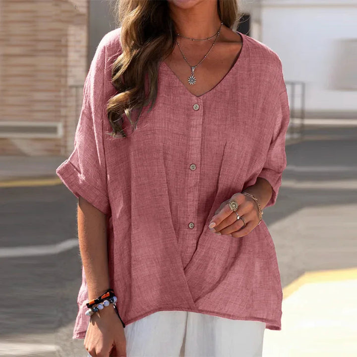 Vrouwen dragen casual damesblouse met V-hals, knopen en lange mouwen. Comfortabele en veelzijdige kleding.