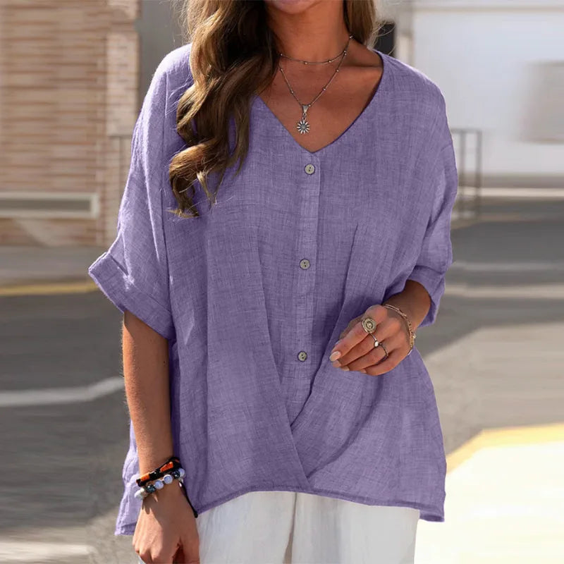 Ruimvallende damesblouse, tuniek-stijl, met V-hals en knopen. Comfortabele lange mouwen, veelzijdig te dragen.