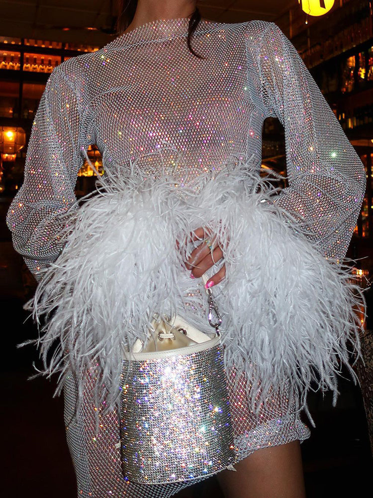 Zwarte KellysDress partyjurk, ronde hals, opvallende details. Stijlvolle korte avondjurk voor dames.