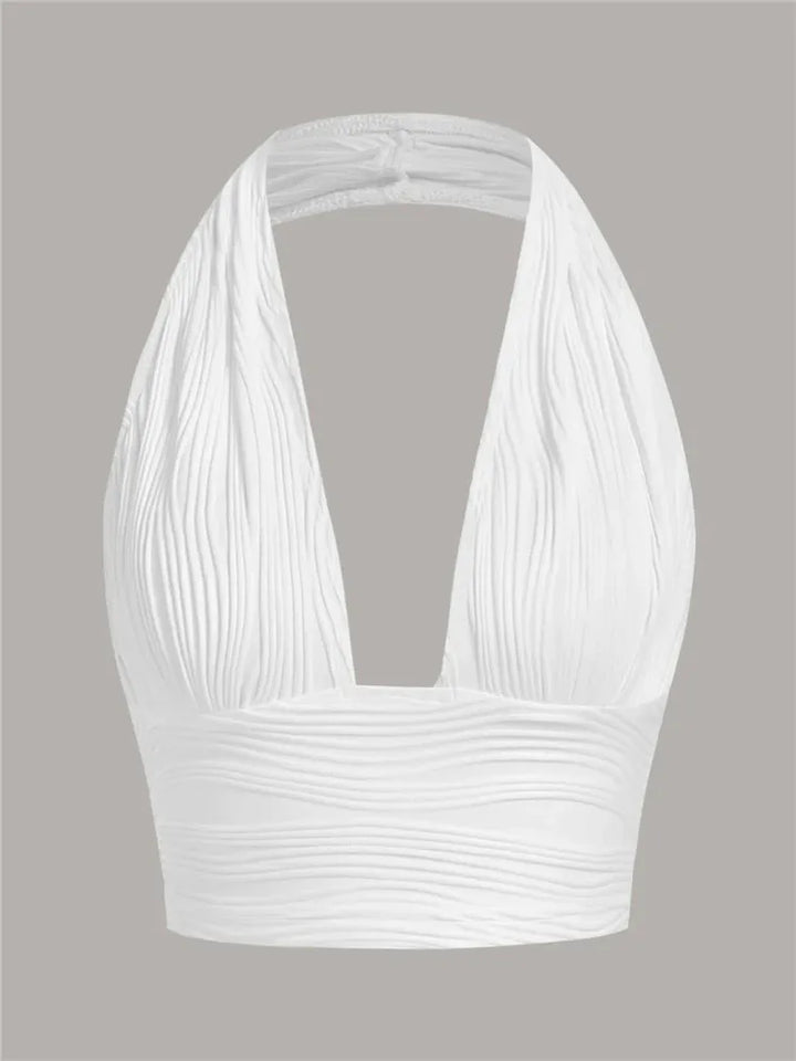 Zwarte Liora halter crop top met diepe uitsnijding en open rug, een trendy dames top voor feesten.