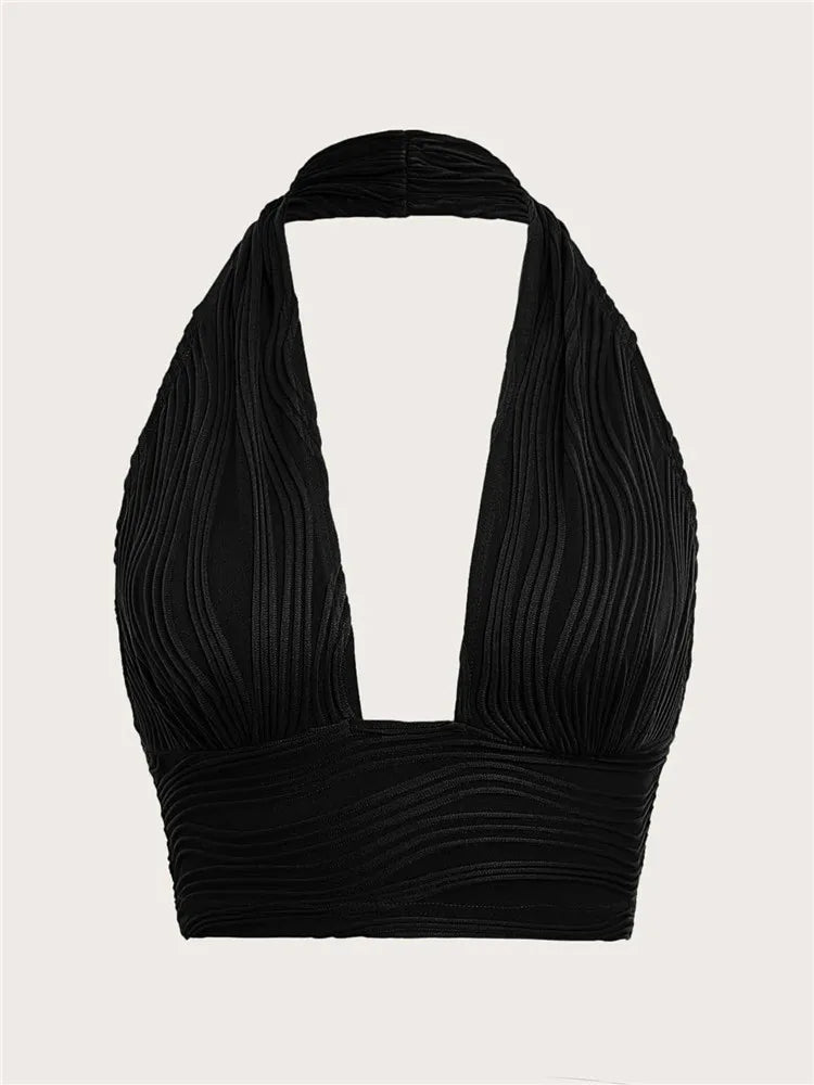 Dames Liora diep uitgesneden halter crop top met open rug in wit. Stijlvolle en verleidelijke zomer top.