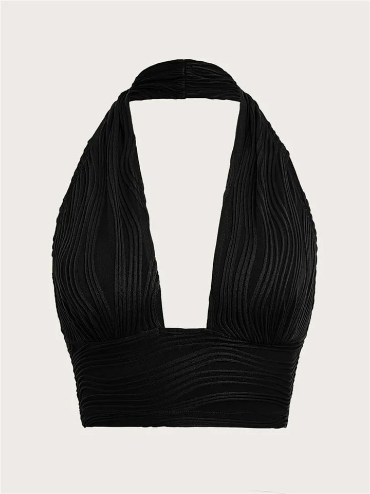 Dames Liora diep uitgesneden halter crop top met open rug in wit. Stijlvolle en verleidelijke zomer top.