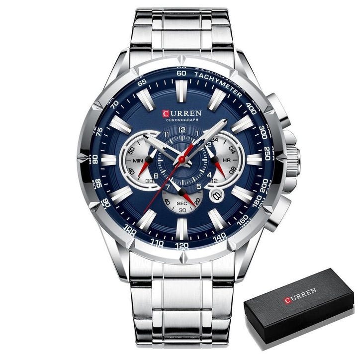 Zilverkleurig herenhorloge met blauwe wijzerplaat en geschenkdoos, toont elegantie.