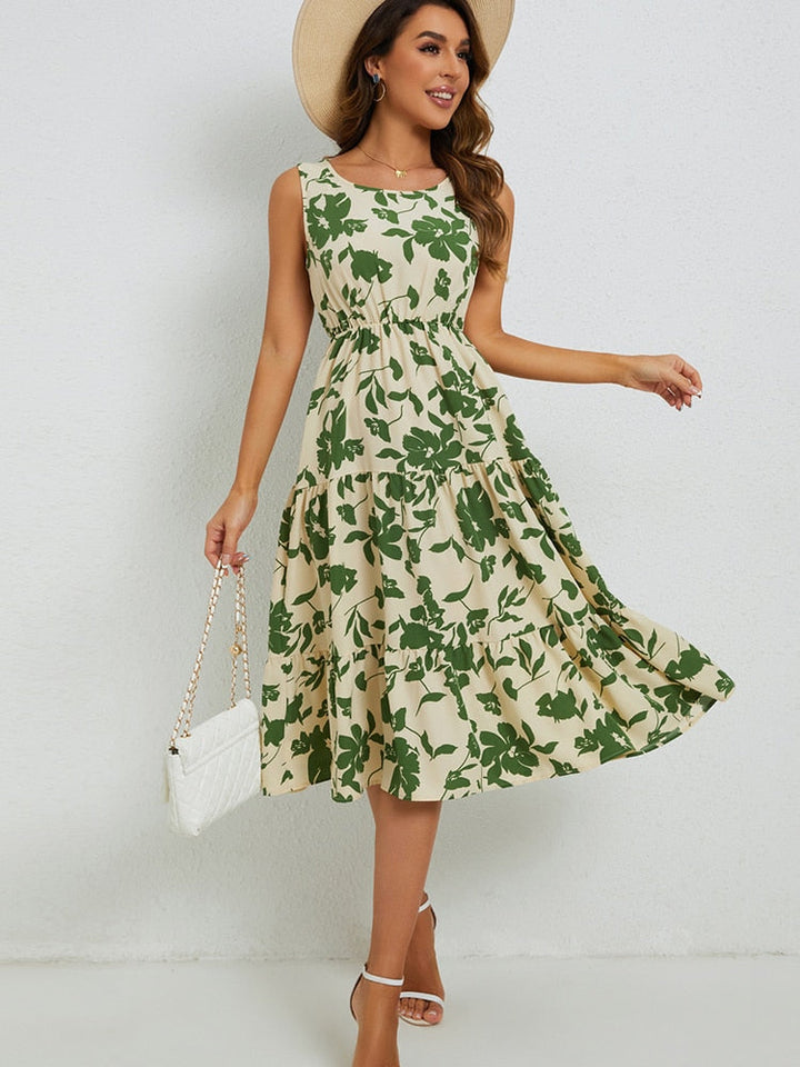Zomerse dames midi-jurk Fenna met levendige bloemenprint; perfect voor casual of feestelijke dagen.