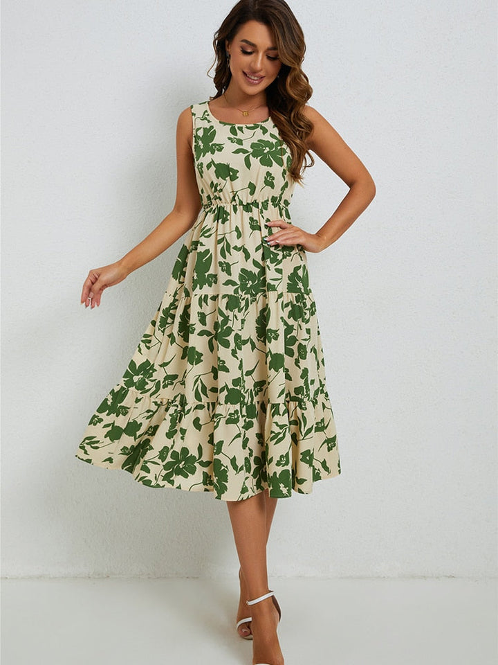 Luchtige Fenna midi-jurk voor dames met vrolijke bloemenprint, comfortabel voor warme zomerdagen.