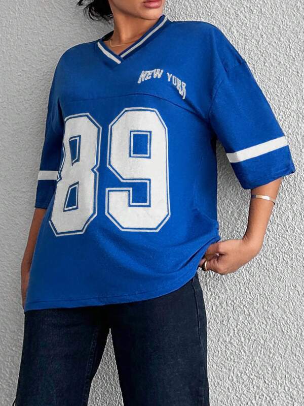 Zwart oversized dames honkbalshirt. Comfortabel en trendy, ideaal voor een sportieve casual look.