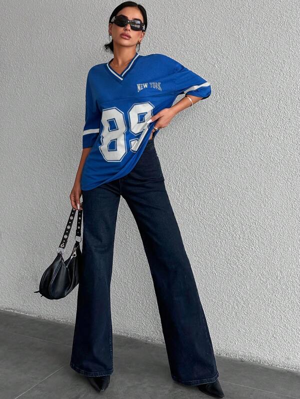 Zwart oversized dames honkbalshirt van zachte stof. Trendy en comfortabel voor een sportieve, casual look.