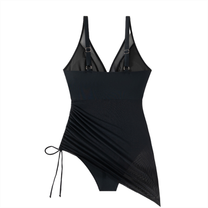 Elegante roze badpakjurk, vormend effect en trendy mesh-inzet aan de zijkant. Ideale strandmode.