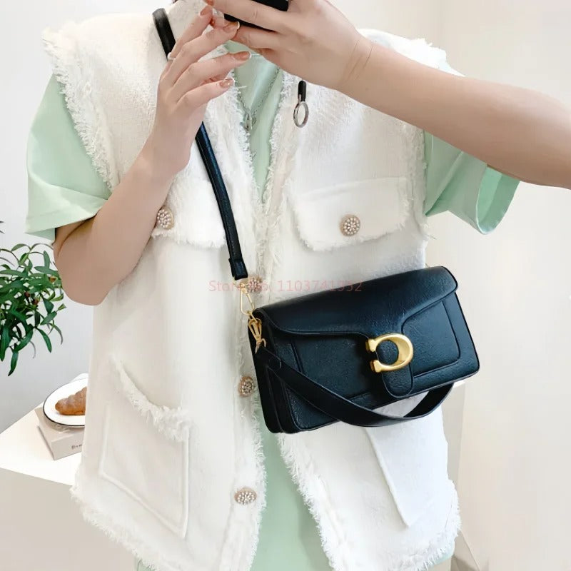 Zwarte elegante dames handtas met ruime opbergruimte, ideaal voor dagelijks stijlvol gebruik als mode-accessoire.