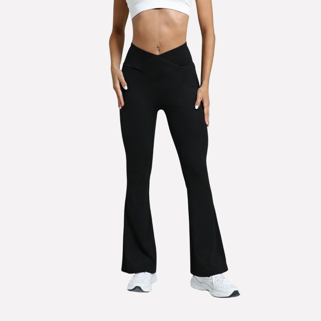 Zwarte flare legging voor dames met elegante crossover hoge taille en brede pijp, comfortabel en modieus.