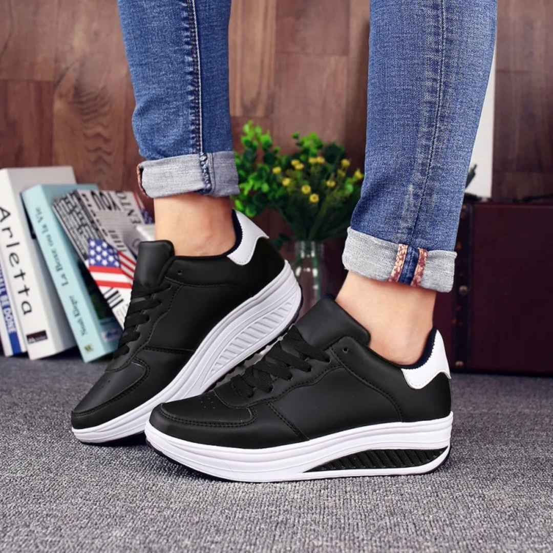 Lichtgewicht zwarte FlexiStep orthopedische dames sneakers, ontworpen voor comfort en langdurig dagelijks gebruik.