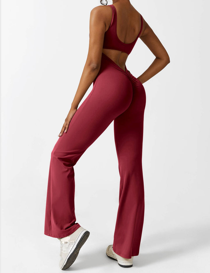 Groene V-hals jumpsuit Liv met wijde pijpen en open rug, perfect voor een elegante en trendy verschijning.