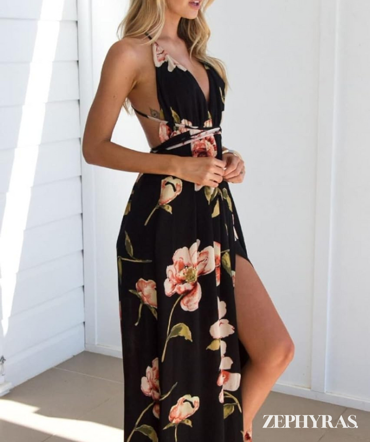 Dames zwarte maxi-jurk Mayra met vrolijke bloemenprint en losse pasvorm. Ideaal voor de zomer, katoenmix.