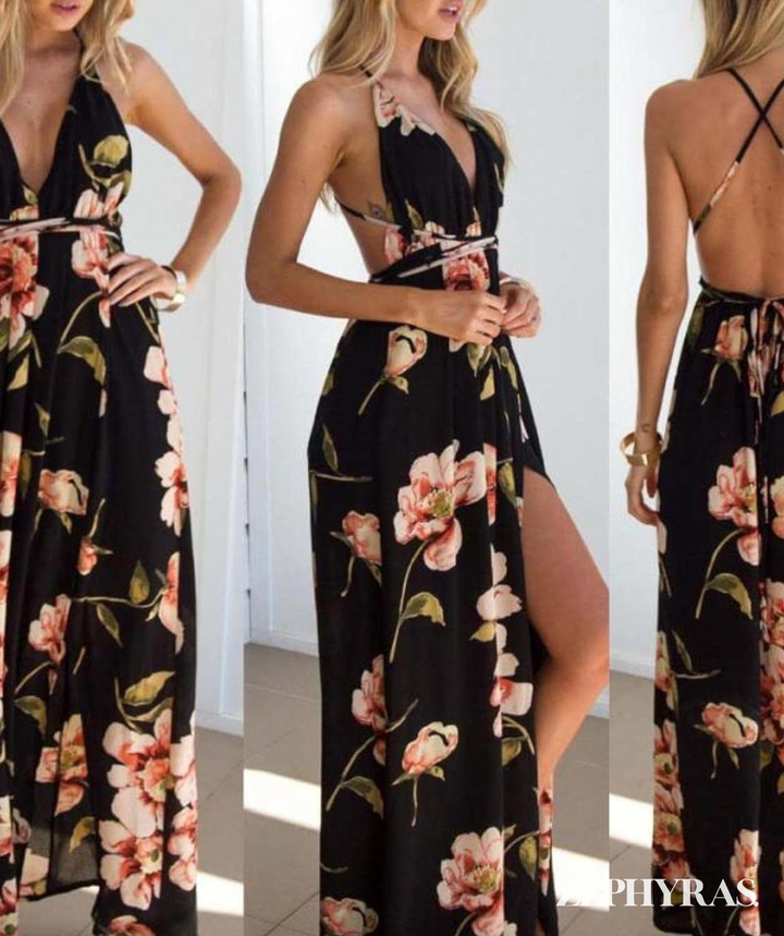 Model in zwarte zomerjurk Mayra, bloemenprint, v-hals en comfortabele losse pasvorm. Mouwloze dames maxi-jurk.